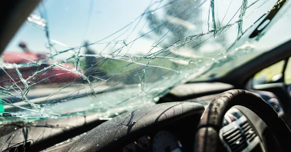 Car windshield is shattered after an accident.