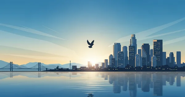 A bird flies over a city skyline at sunset.