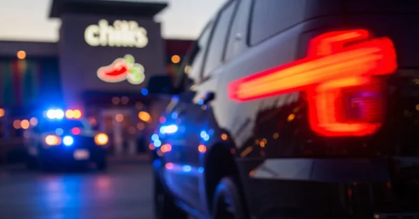Police respond to an incident outside a Chili's restaurant.