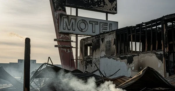 A motel lies in ruins after a fire.