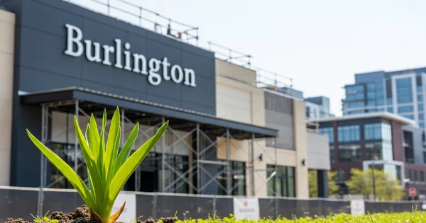 A new Burlington retail store undergoes construction in an urban development area.